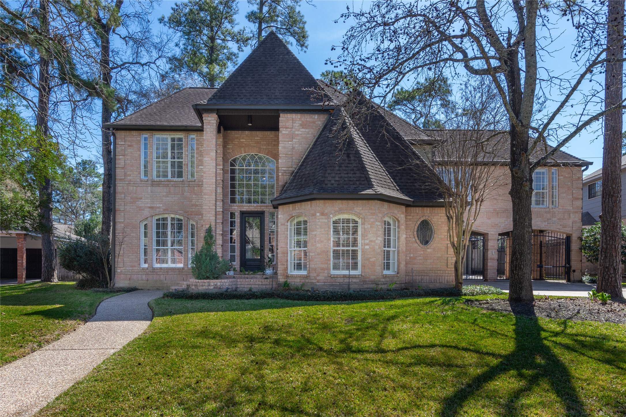 6211 Kingscrest Lane Spring, TX 77389 - Photo 2 of 38 a front view of a house with garden