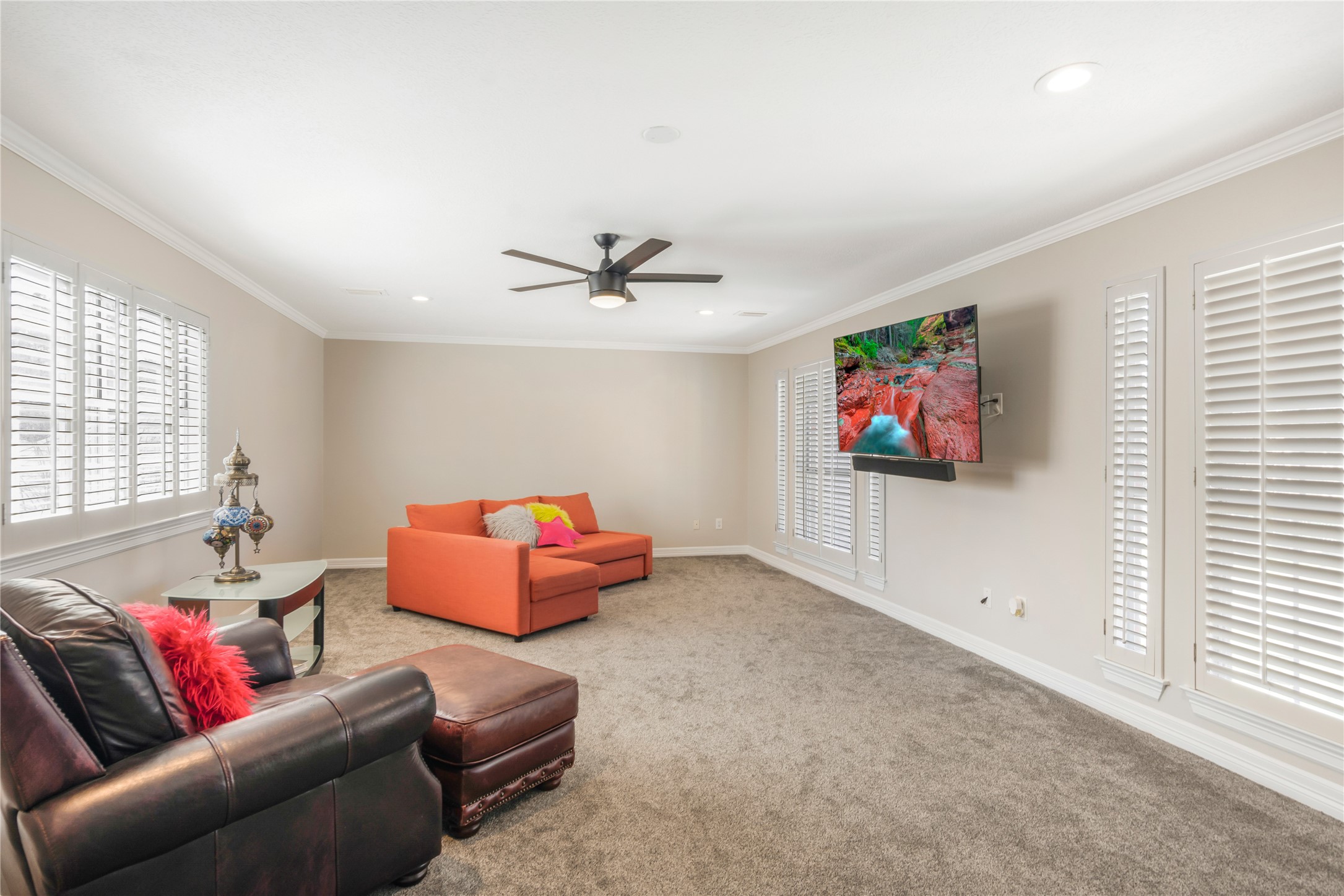 6211 Kingscrest Lane Spring, TX 77389 - Photo 25 of 38 a living room with furniture and a flat screen tv