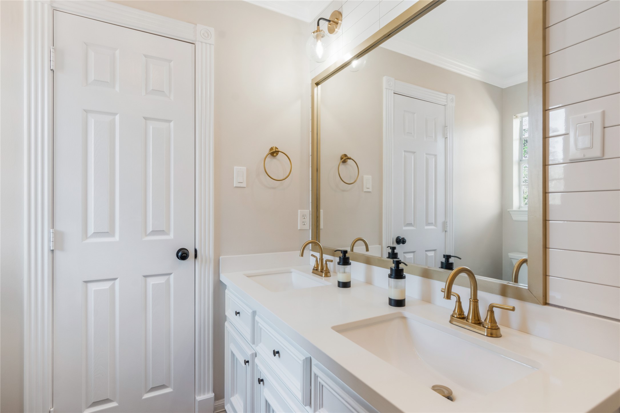 6211 Kingscrest Lane Spring, TX 77389 - Photo 32 of 38 a bathroom with double vanity sink and a mirror