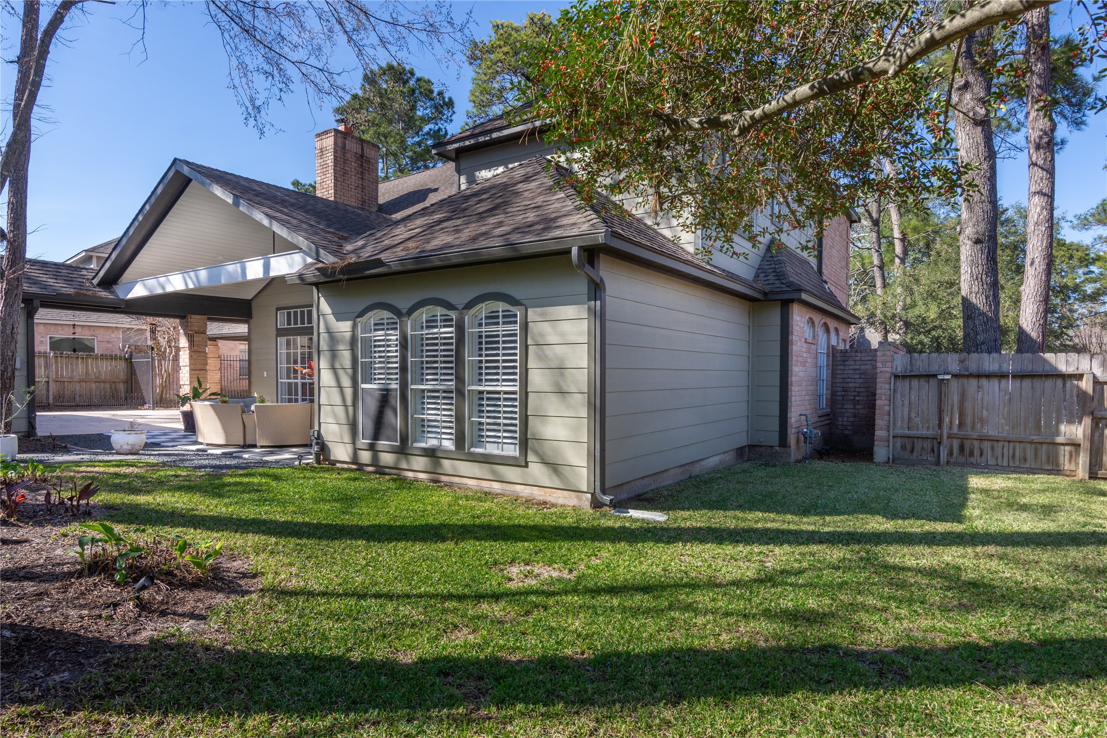 6211 Kingscrest Lane Spring, TX 77389 - Photo 36 of 38 a front view of a house with a yard table and chairs