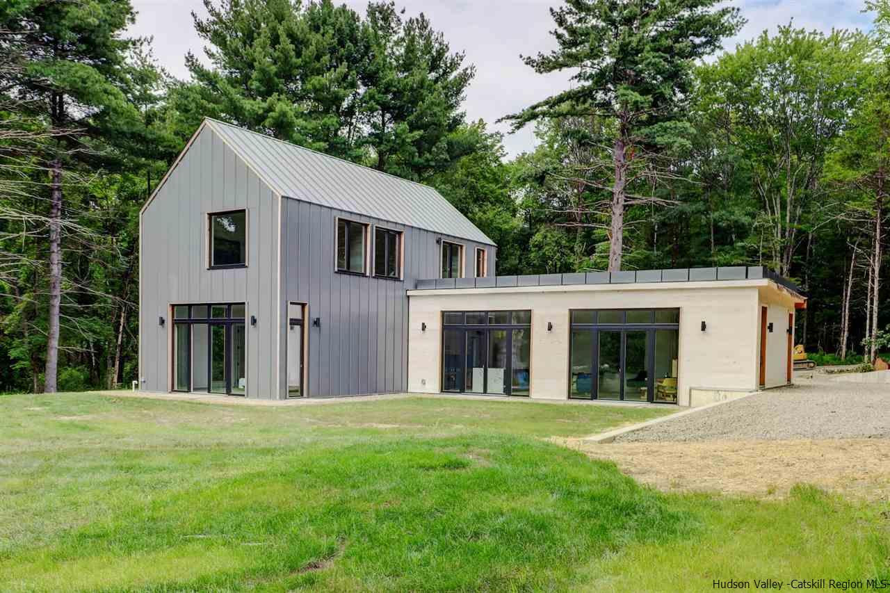 10 Old Runway Road Stone Ridge, NY 12484 - Photo 1 of 32 a view of a white house with a big yard and large trees