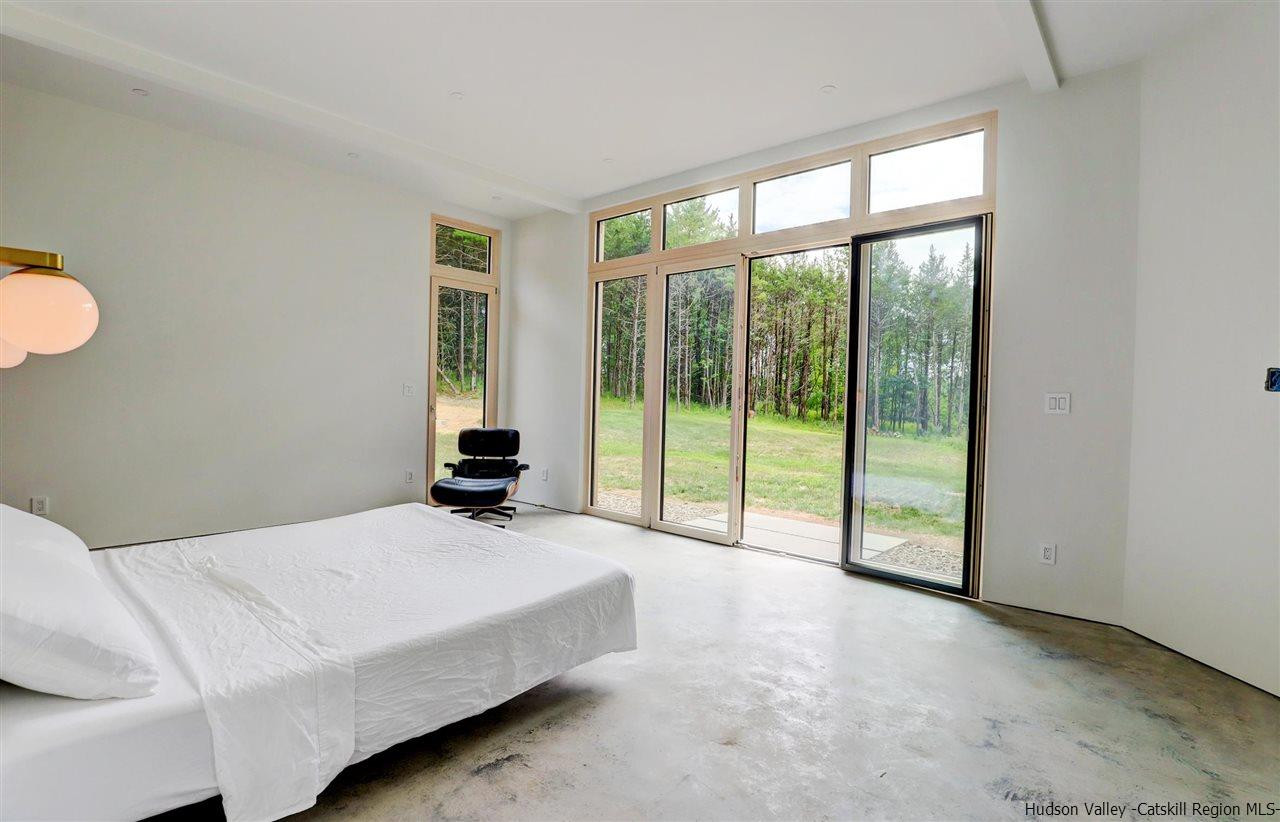 10 Old Runway Road Stone Ridge, NY 12484 - Photo 15 of 32 a bedroom with a bed and a large window