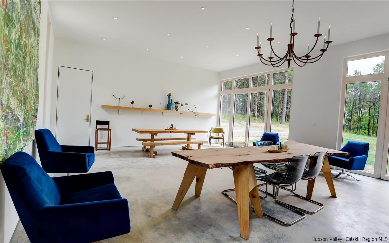 10 Old Runway Road Stone Ridge, NY 12484 - Photo 8 of 32 a view of a dining room with furniture window and wooden floor