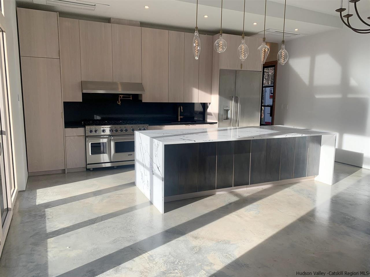 10 Old Runway Road Stone Ridge, NY 12484 - Photo 10 of 32 a kitchen with granite countertop a stove a sink and a microwave
