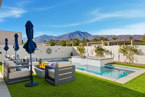 a view of a swimming pool with a patio
