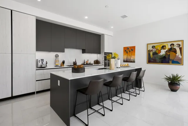a kitchen with a sink cabinets and window