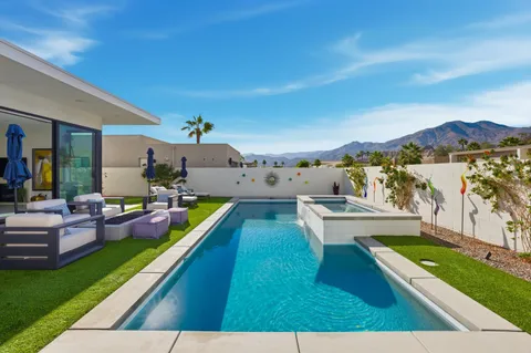 a view of a house with swimming pool