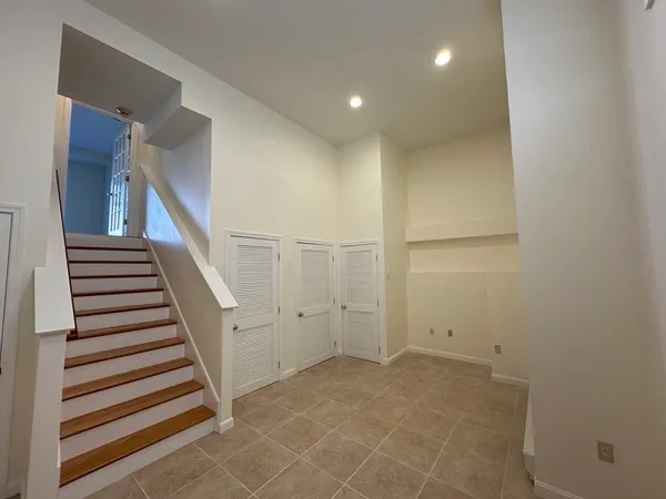 a view of a hallway with staircase