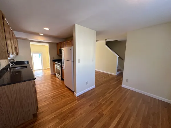 a view of a kitchen from the hallway
