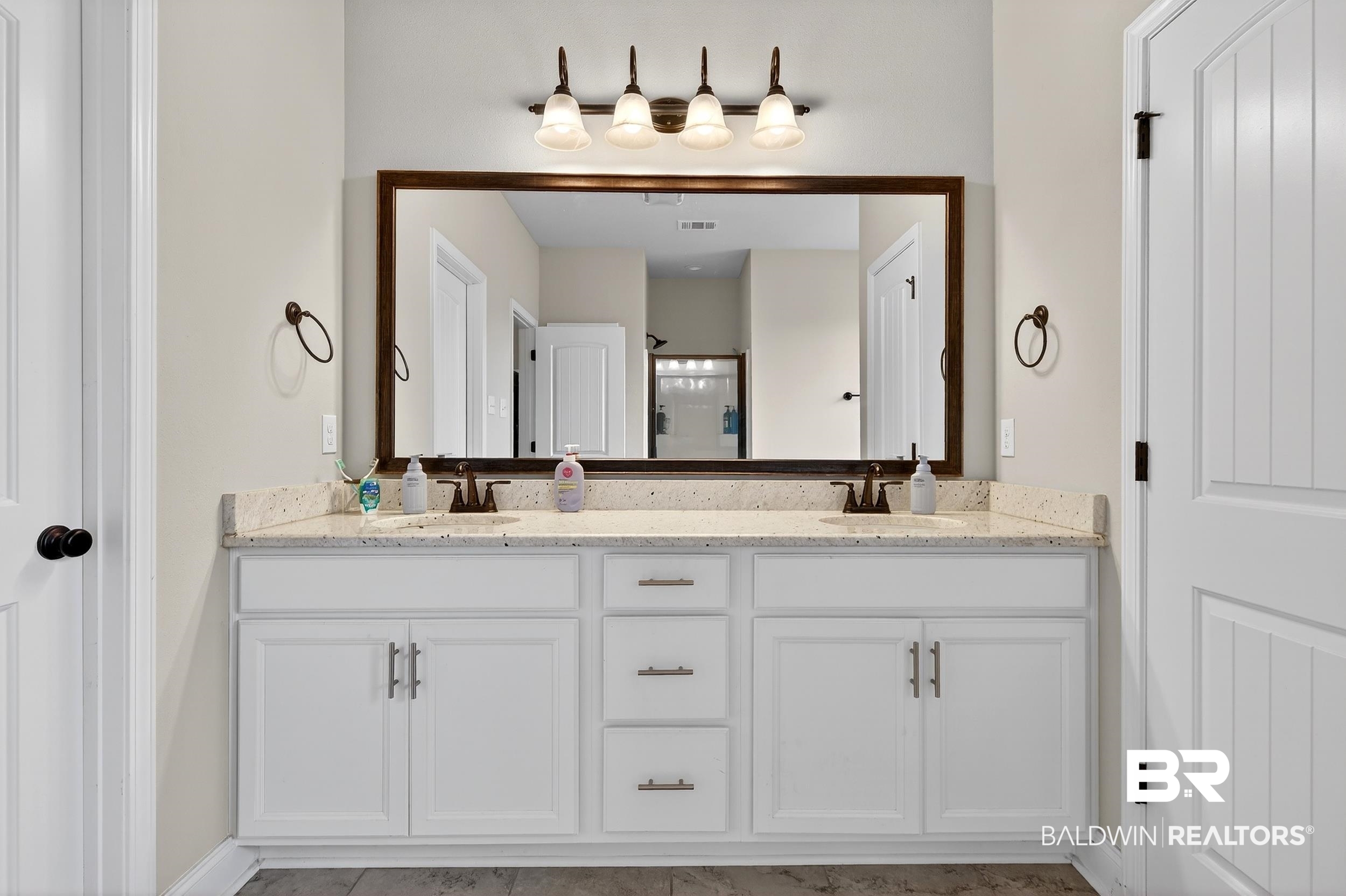 1084 Stella Road Foley, AL 36535 - Photo 20 of 31 Full bathroom with double vanity and a shower stall