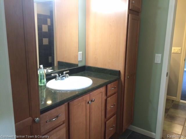 4770 Golf Club Road Howell, MI 48843 - Photo 53 of 59 Upper Jack and Jill Bath has granite counters
