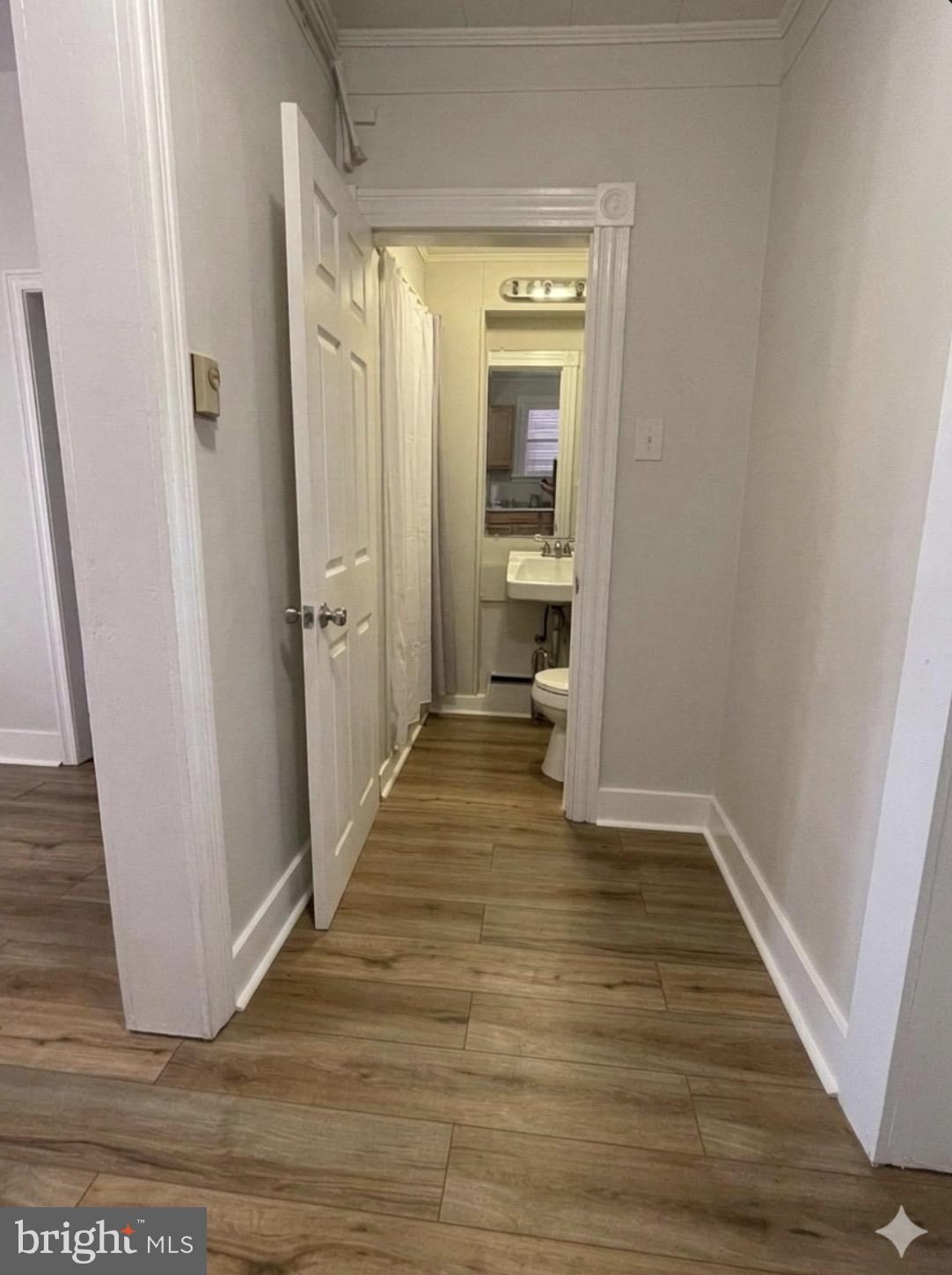 8 South Maple Avenue Brunswick, MD 21716 - Photo 12 of 13 a view of a bathroom with wooden floor