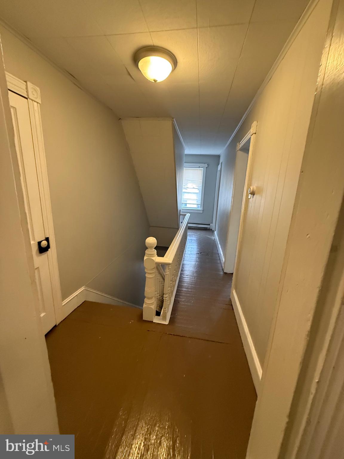 8 South Maple Avenue Brunswick, MD 21716 - Photo 7 of 13 a view of a hallway with wooden floor