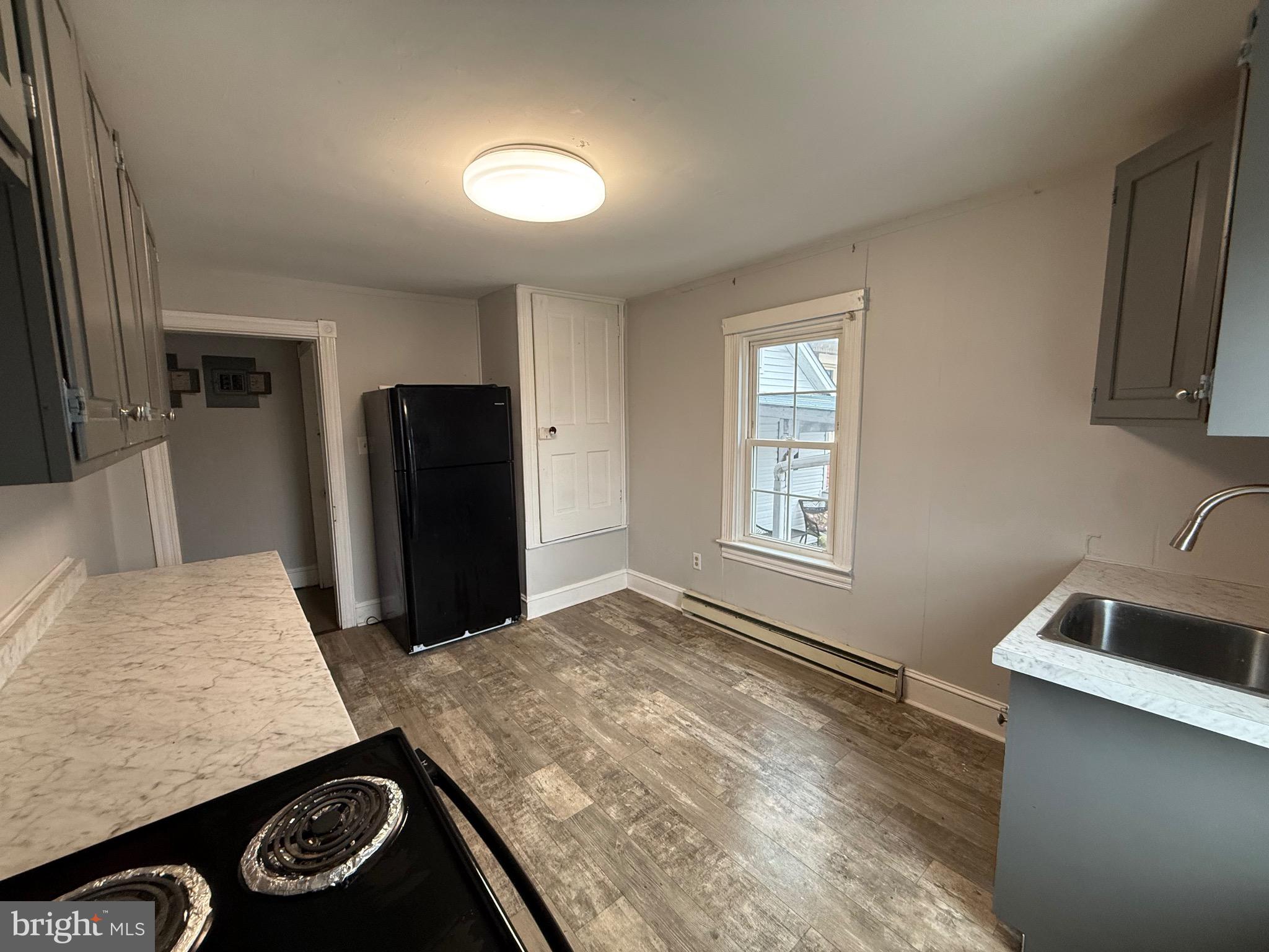 8 South Maple Avenue Brunswick, MD 21716 - Photo 9 of 13 a view of kitchen with sink and refrigerator
