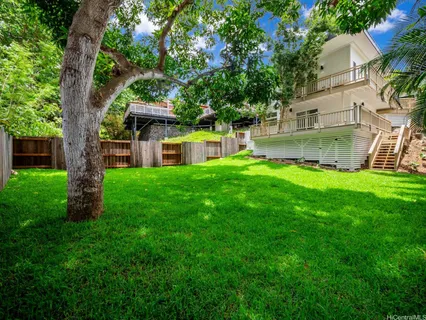 a view of a house with a yard porch and sitting area