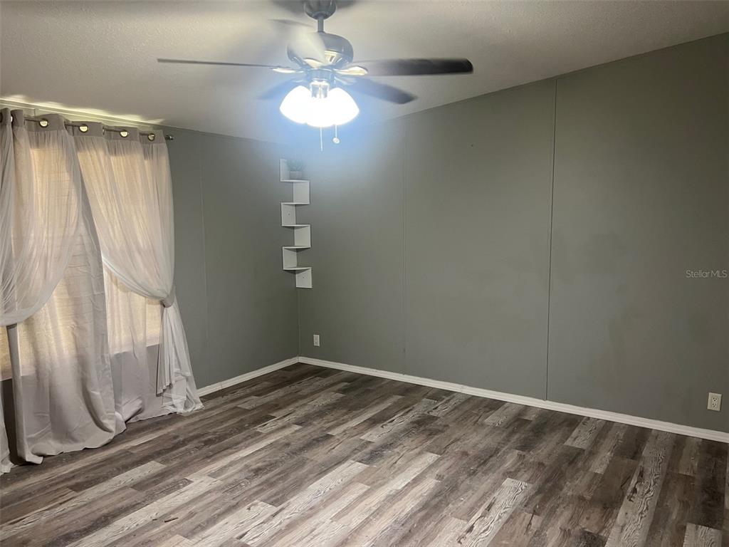 328 Old Peniel Road Palatka, FL 32177 - Photo 6 of 18 a view of small space with wooden floor and a window