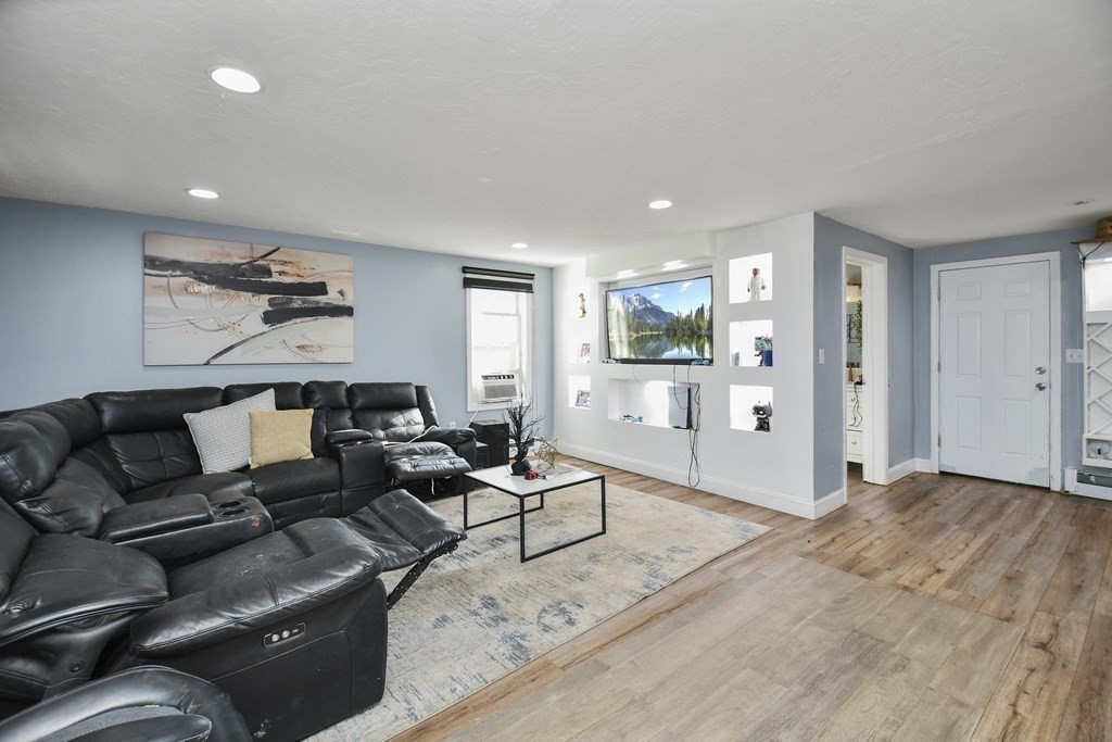 44 Catalpa Circle Worcester, MA 01603 - Photo 13 of 29 a living room with furniture and wooden floor