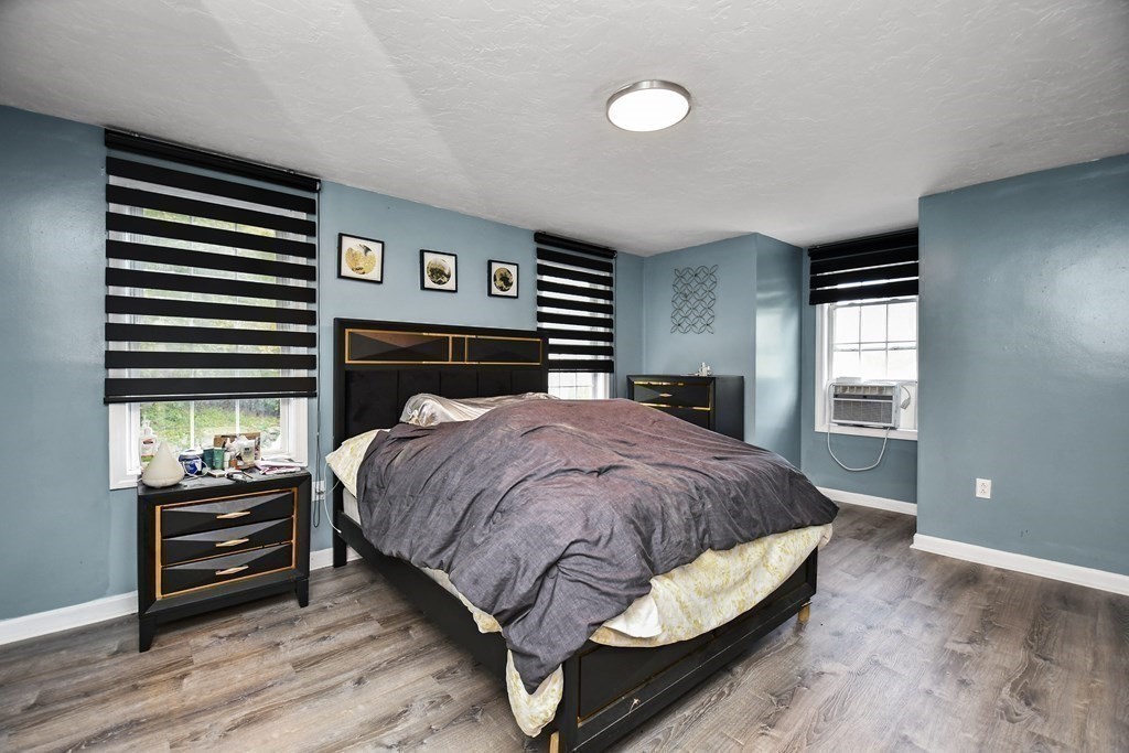 44 Catalpa Circle Worcester, MA 01603 - Photo 15 of 29 a bed sitting in a bedroom next to a window and dresser