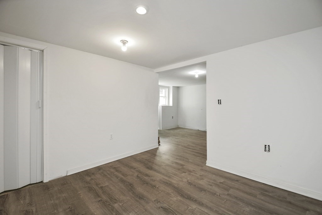 44 Catalpa Circle Worcester, MA 01603 - Photo 28 of 29 a view of an empty room with wooden floor and closet