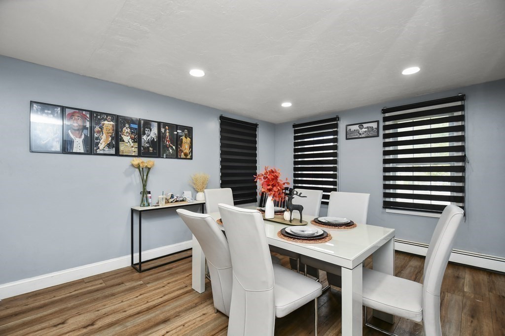 44 Catalpa Circle Worcester, MA 01603 - Photo 10 of 29 a view of a dining room with furniture wooden floor and a window