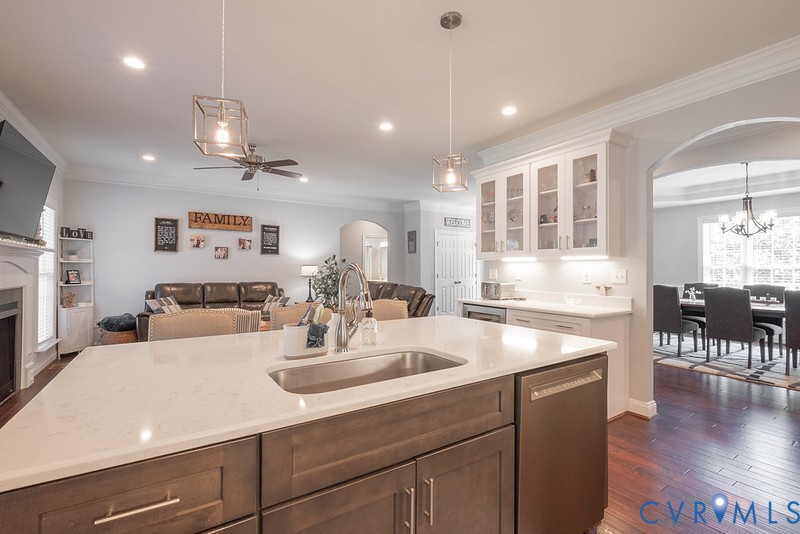 9425 Marie Road New Kent, VA 23124 - Photo 6 of 55 a room with stainless steel appliances kitchen island granite countertop a sink and wooden floor