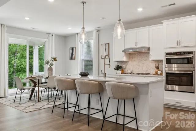 a view of a dining room with furniture and window