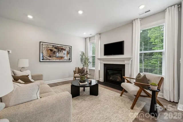 a living room with furniture and a table