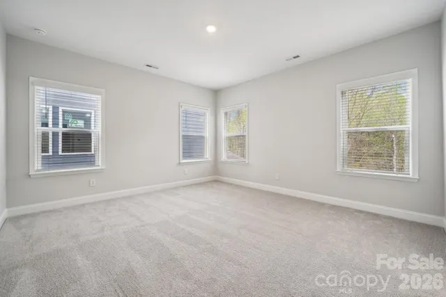 a bathroom with double sink and a mirror