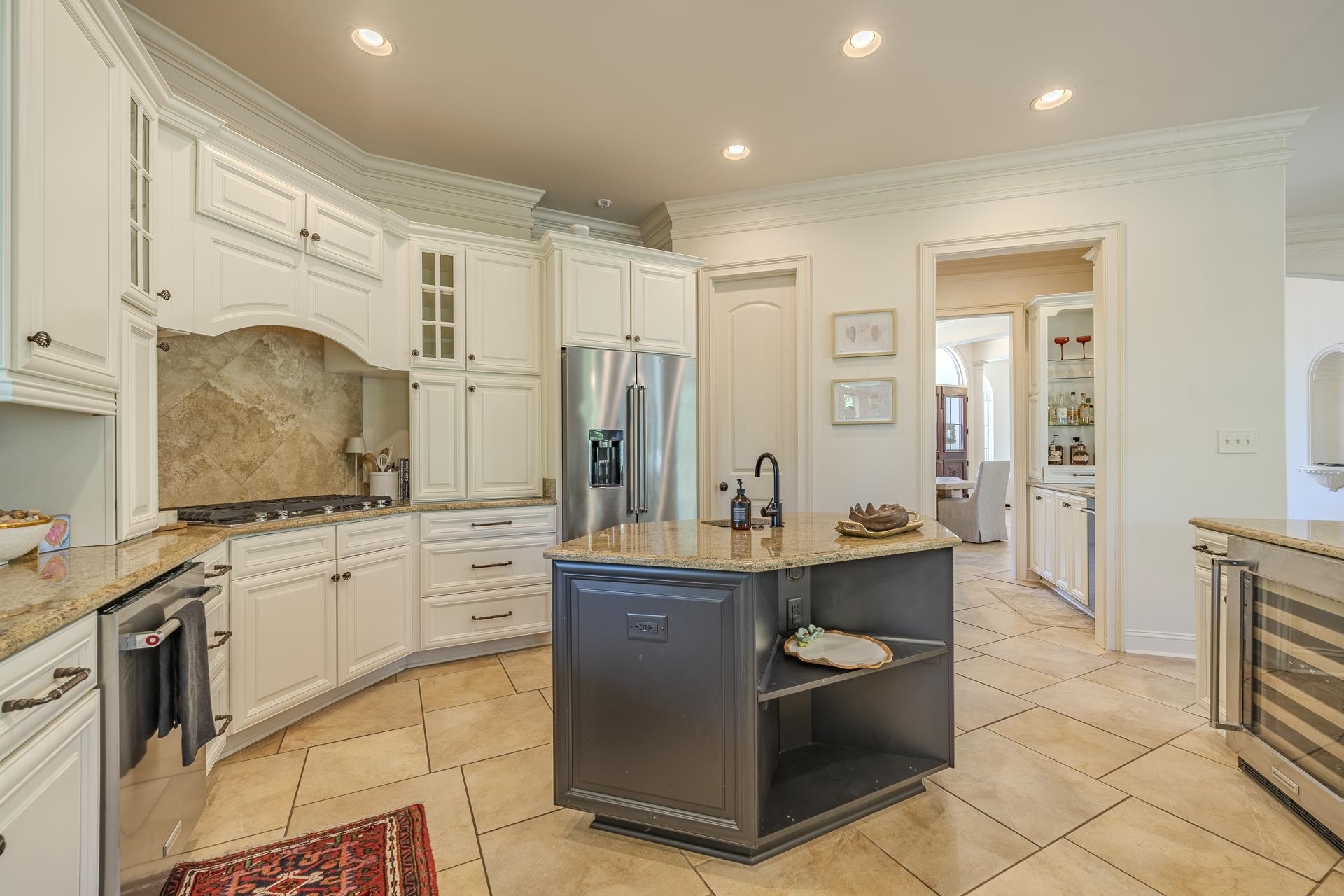 105 Riviera Cove Savannah, TN 38372 - Photo 11 of 40 a kitchen with stainless steel appliances a stove refrigerator sink and cabinets