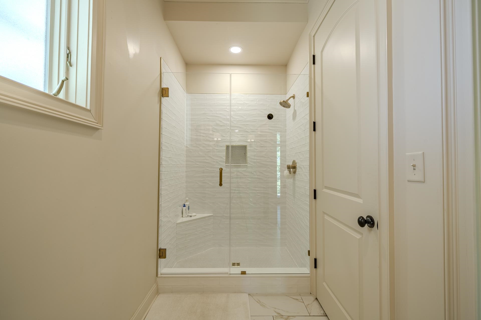 105 Riviera Cove Savannah, TN 38372 - Photo 23 of 40 a bathroom with a glass shower door