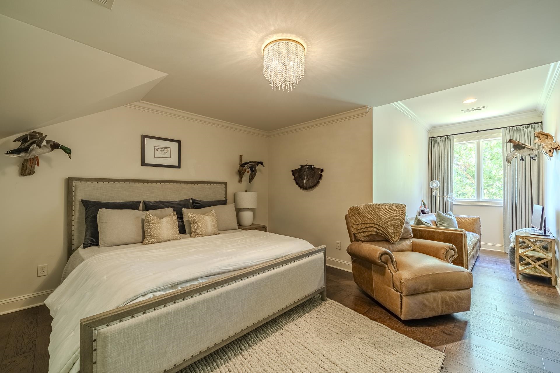 105 Riviera Cove Savannah, TN 38372 - Photo 24 of 40 a bedroom with bed couch and window