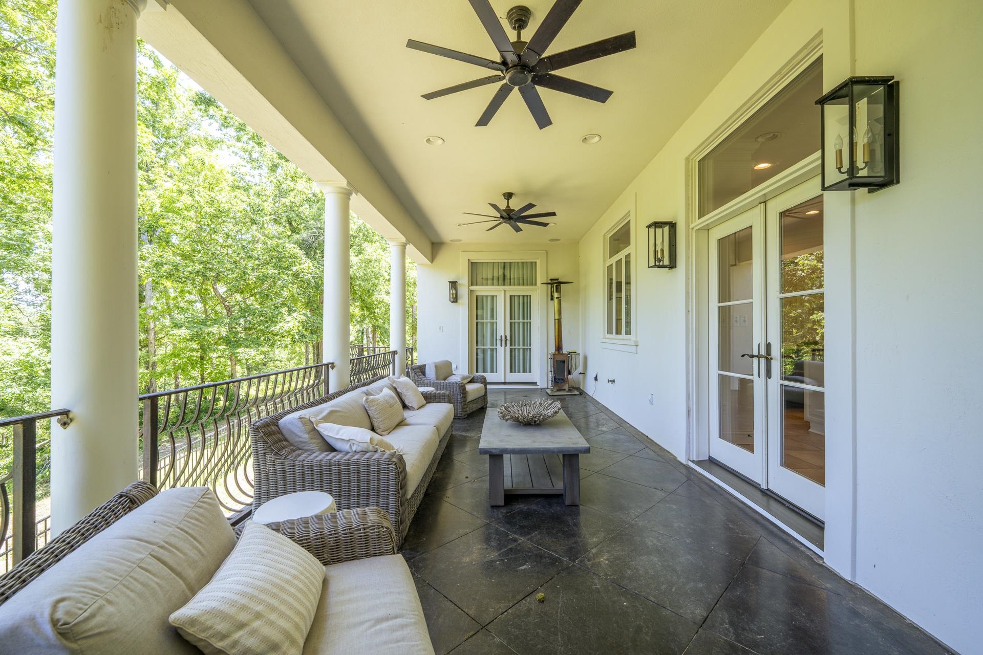 105 Riviera Cove Savannah, TN 38372 - Photo 30 of 40 a living room with furniture and a floor to ceiling window
