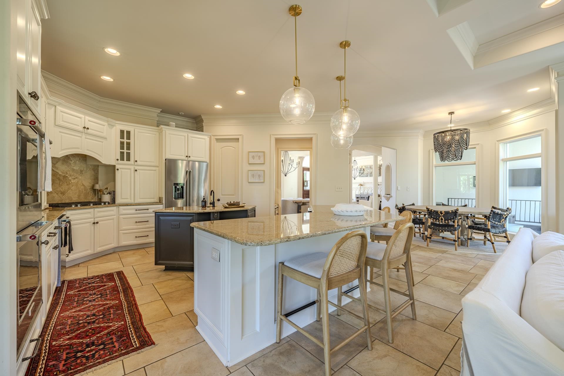 105 Riviera Cove Savannah, TN 38372 - Photo 9 of 40 a large kitchen with lots of counter space dining table and chairs