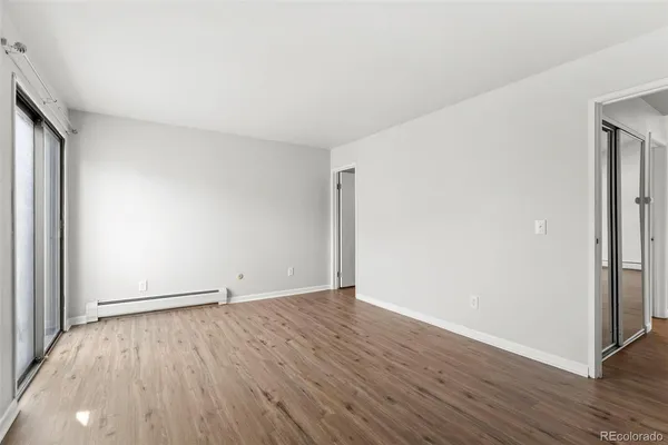 an empty room with wooden floor
