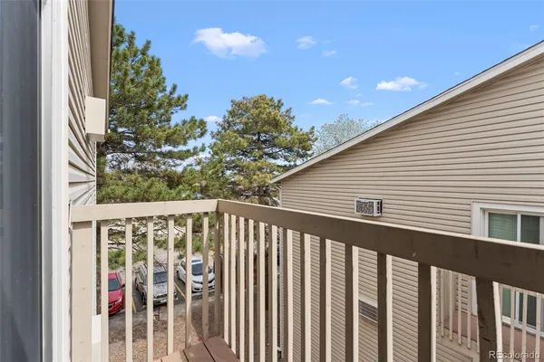 a side view of a house with a balcony