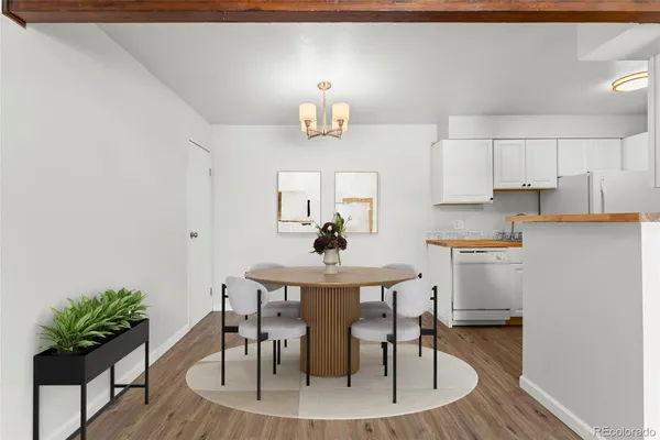 a view of kitchen with sink dining table and chairs