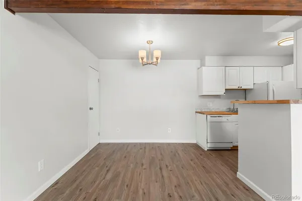 a view of storage and utility room with wooden floor