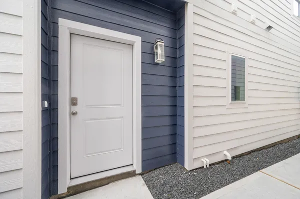 a view of kitchen with wooden floor and electronic appliances