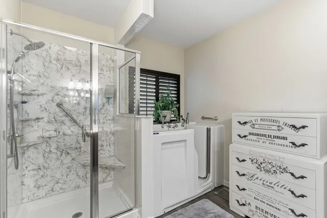 a view of backyard with swimming pool and green space