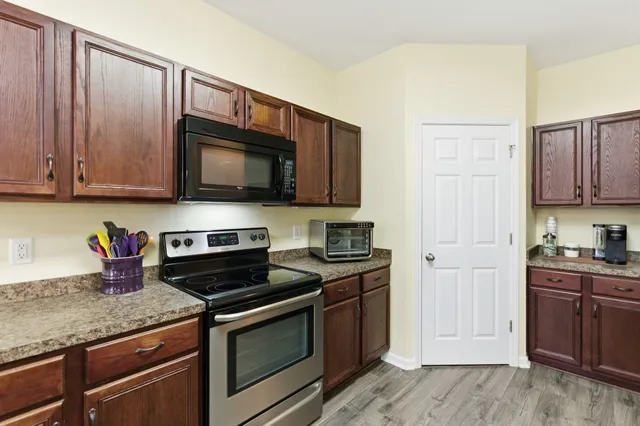a workspace with furniture hardwood and a window