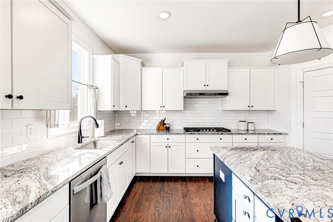 17101 Westington Road Moseley, VA 23120 - Photo 13 of 50 a kitchen with granite countertop a sink stove and cabinets