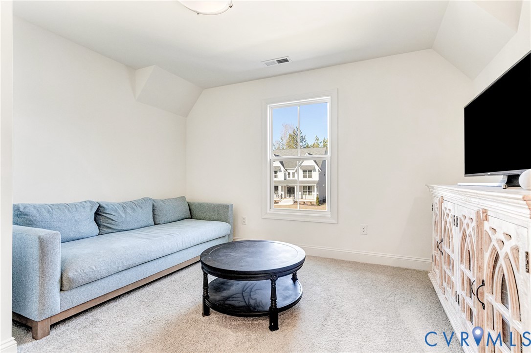 17101 Westington Road Moseley, VA 23120 - Photo 26 of 50 a living room with furniture and a flat screen tv