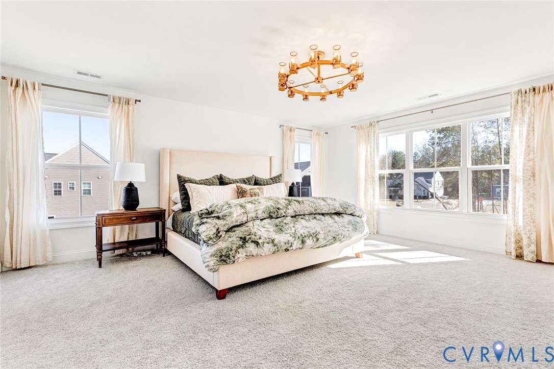 17101 Westington Road Moseley, VA 23120 - Photo 28 of 50 a spacious bedroom with a bed and a large window