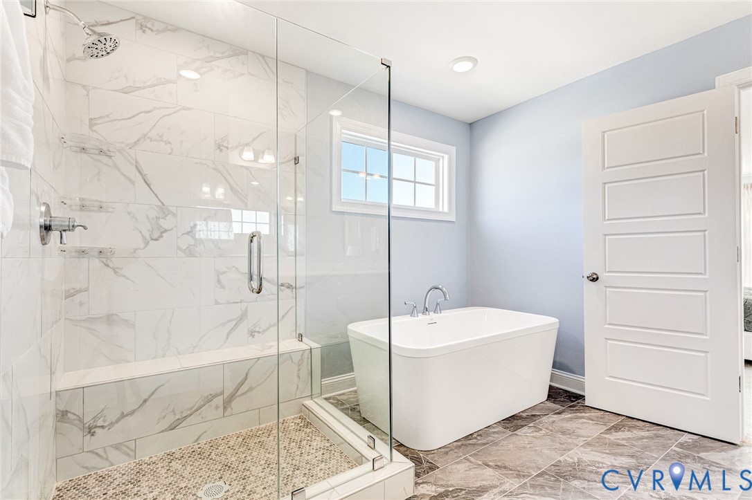 17101 Westington Road Moseley, VA 23120 - Photo 34 of 50 a bathroom with a sink a mirror and a bathtub