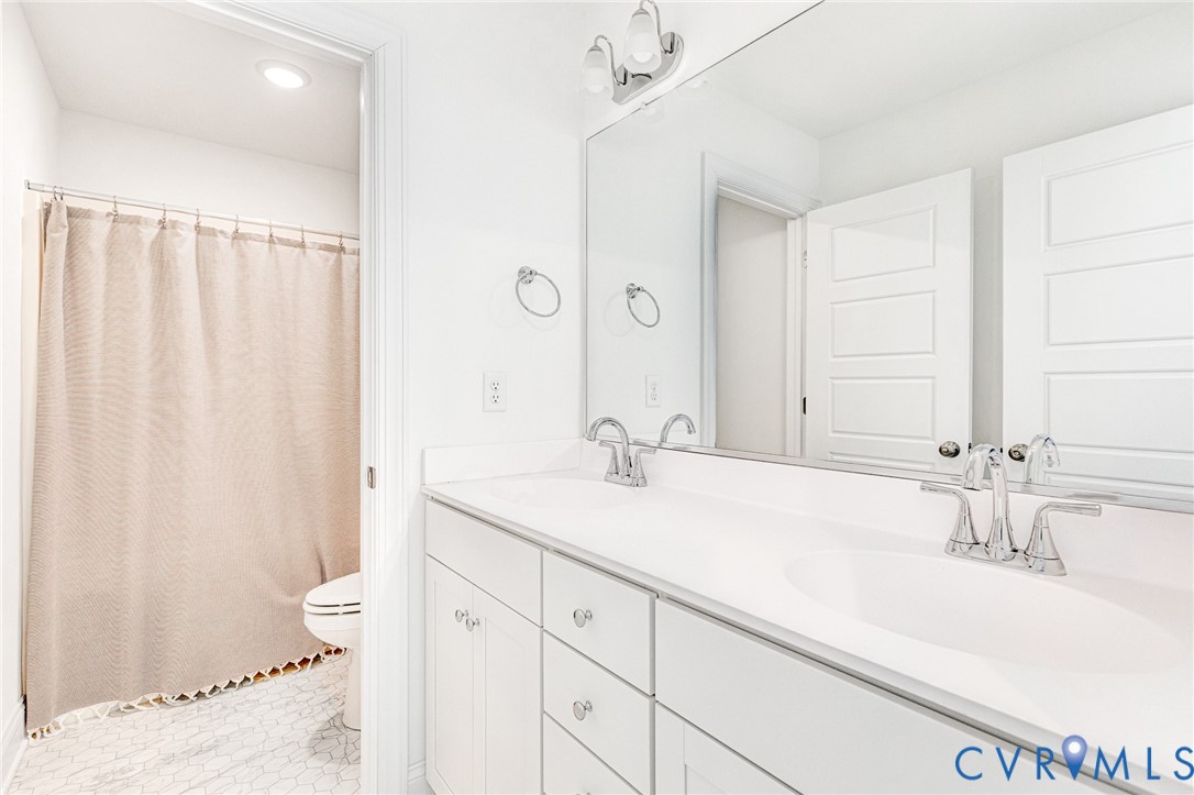 17101 Westington Road Moseley, VA 23120 - Photo 41 of 50 a bathroom with a sink and a mirror