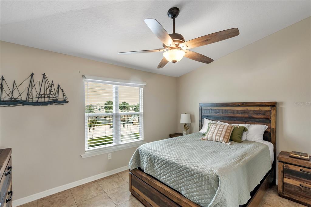 6420 Banyan Boulevard, Unit 303 New Port Richey, FL 34652 - Photo 16 of 54 a bedroom with a bed and a window