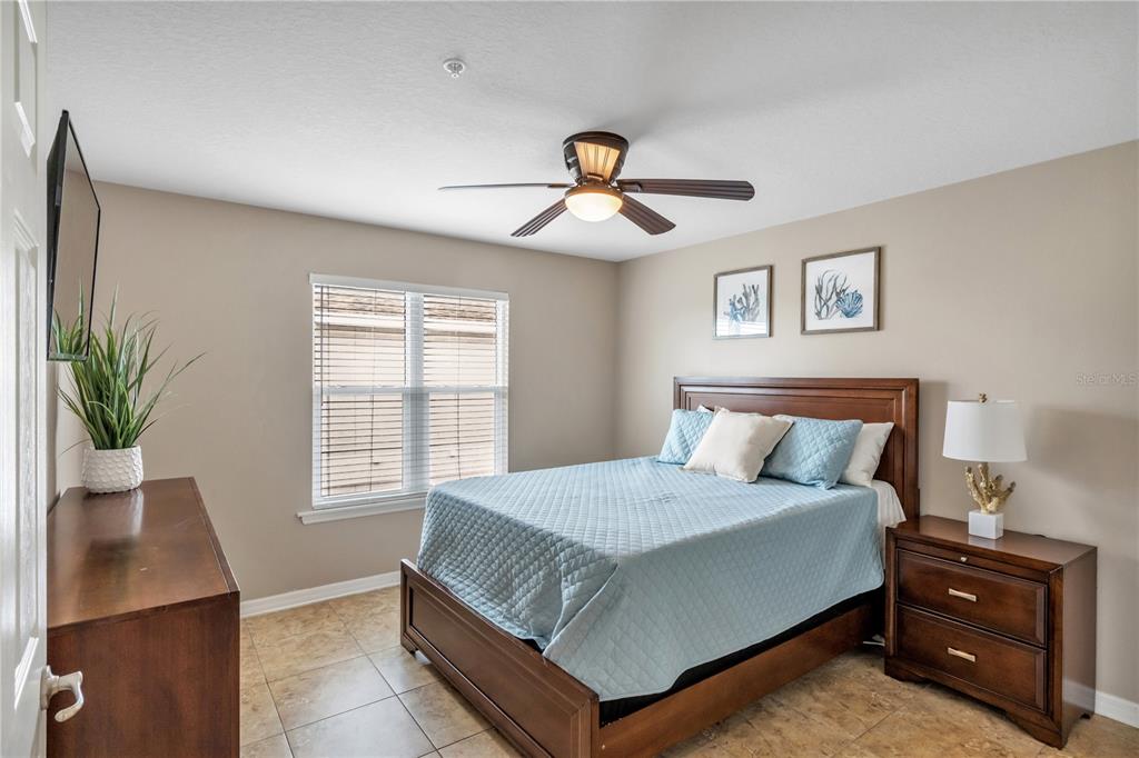 6420 Banyan Boulevard, Unit 303 New Port Richey, FL 34652 - Photo 23 of 54 a bedroom with a bed and window