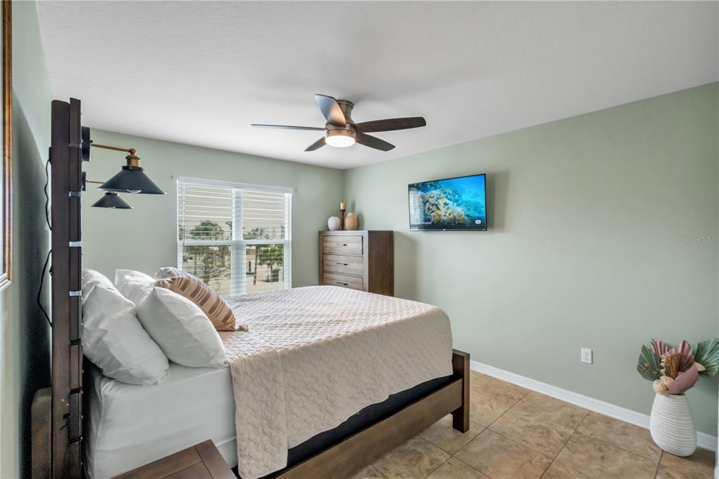 6420 Banyan Boulevard, Unit 303 New Port Richey, FL 34652 - Photo 27 of 54 a bedroom with a bed and a window