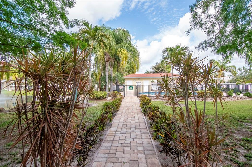 6420 Banyan Boulevard, Unit 303 New Port Richey, FL 34652 - Photo 30 of 54 a view of a house with a yard