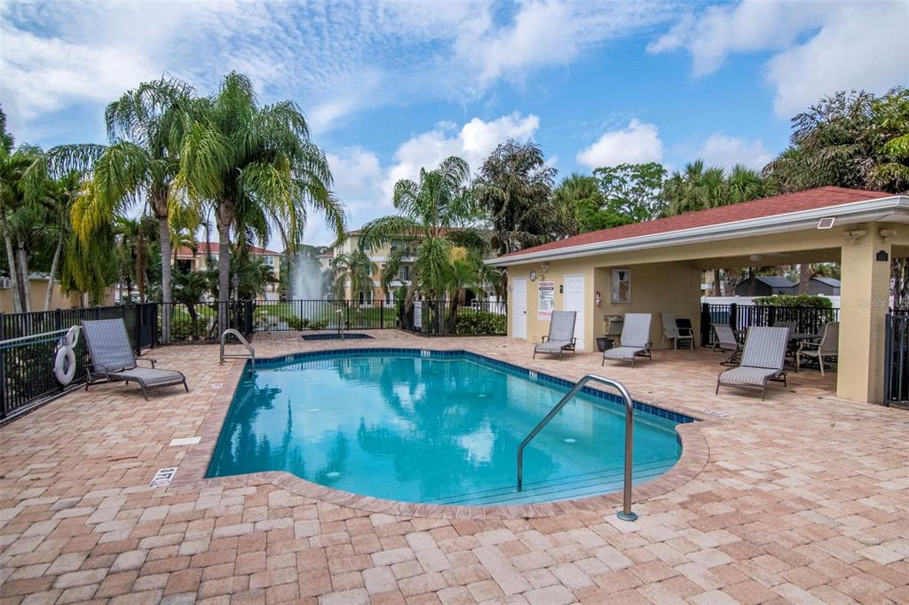 6420 Banyan Boulevard, Unit 303 New Port Richey, FL 34652 - Photo 34 of 54 a view of a house with swimming pool and sitting area